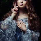 Woman with Wavy Hair, Feathered Wings, and Sparkling Necklace