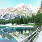 Vibrant illustration of serene lake, boats, house, foliage-covered hills under blue sky