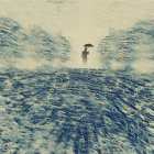 Solitary figure with umbrella in snowy hills and frothy waves