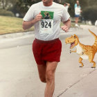 Runner in Red Outfit Carries Toy Crocodile on Tree-Lined Road