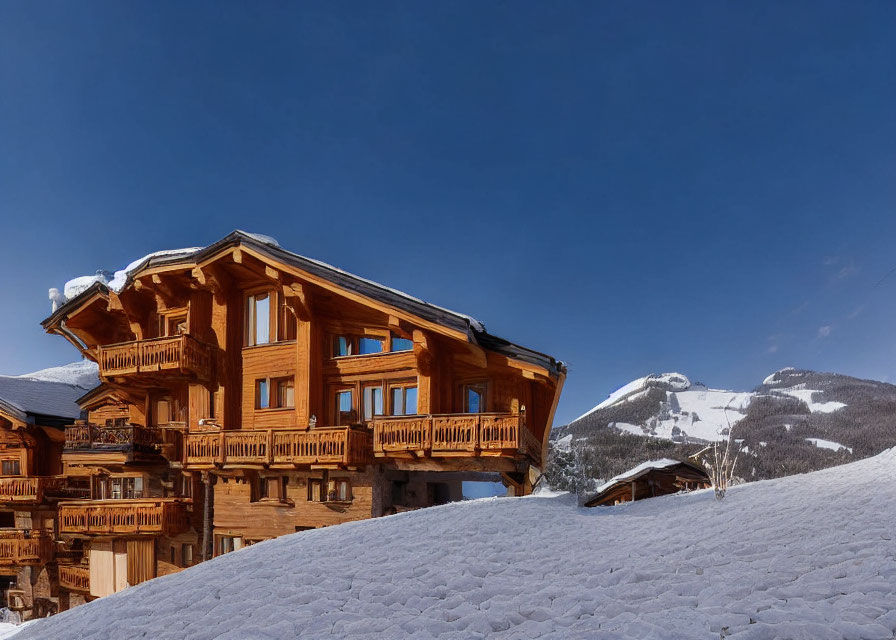 Snow-covered traditional wooden chalet in wintry landscape