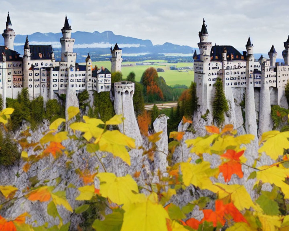 Fairytale castle with white towers on rugged cliff amid autumn trees