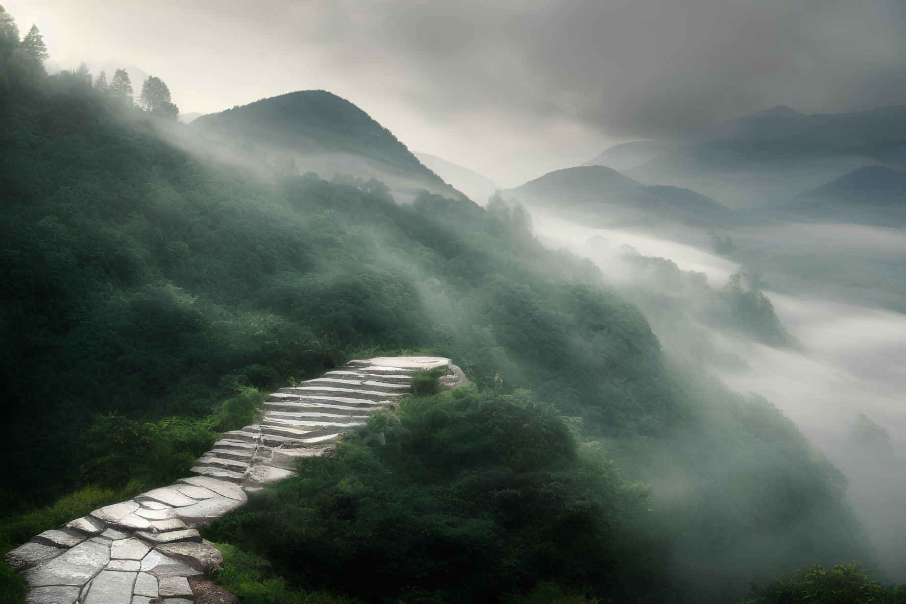 Stone path ascends lush green hillside in misty mountain landscape