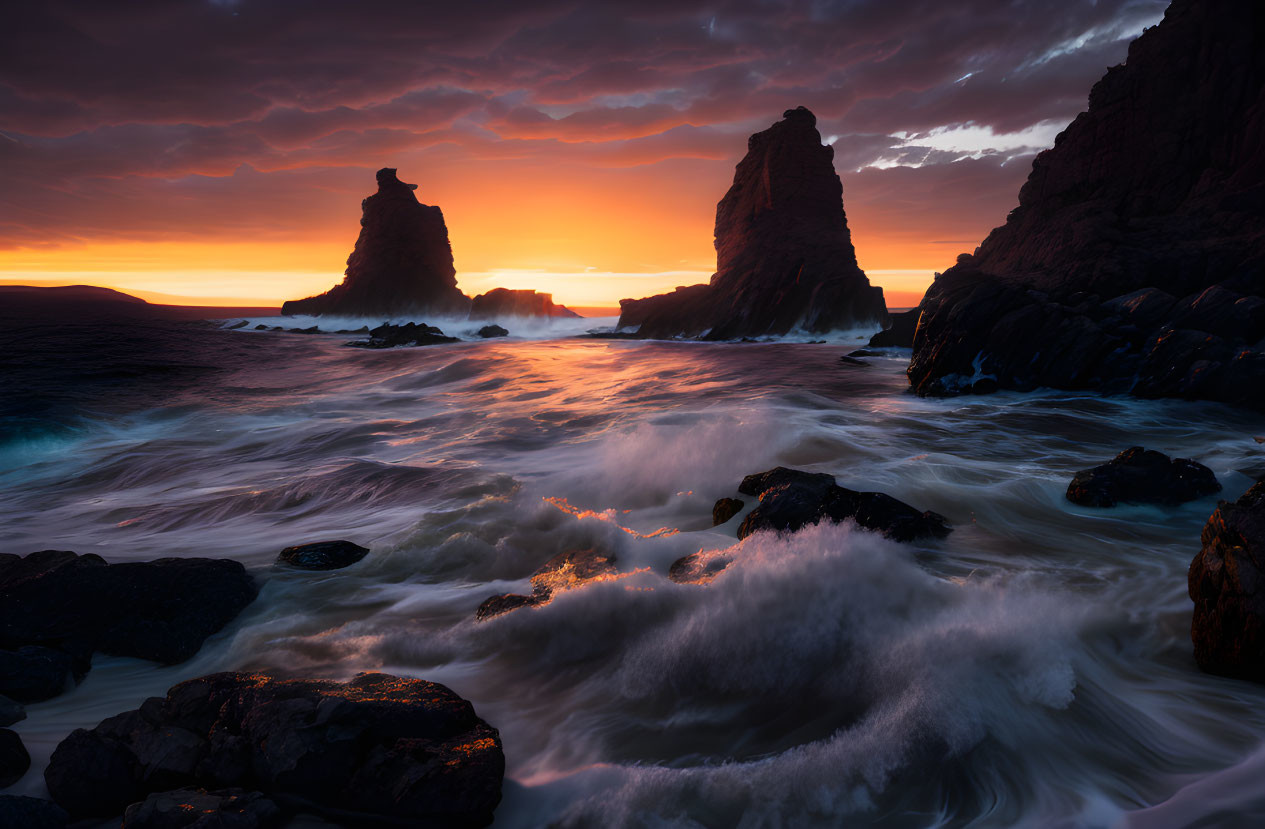 Vibrant sunset seascape with crashing waves and rocky formations