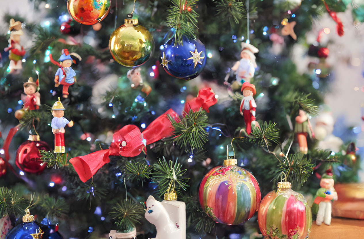 Colorful Christmas tree with baubles, ribbons, and lights