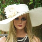 Woman with Striking Blue Eyes in White Hat with Colorful Butterflies