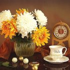 Vibrant chrysanthemums, clock, candlestick, teacup on wooden surface