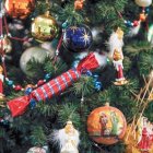 Colorful Christmas tree with baubles, ribbons, and lights