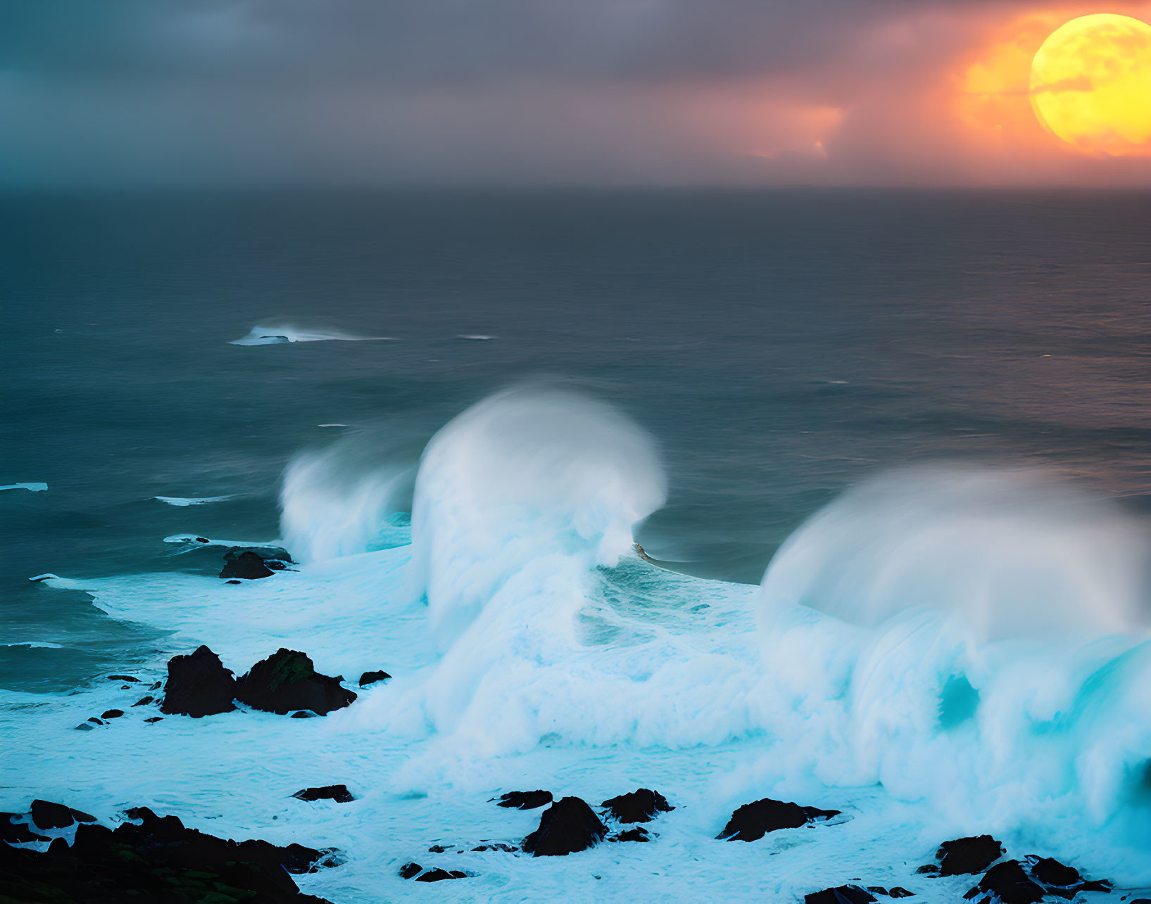 Dramatic sunset seascape with cresting waves and rocks