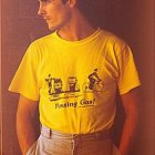 Young man in yellow t-shirt against wooden backdrop