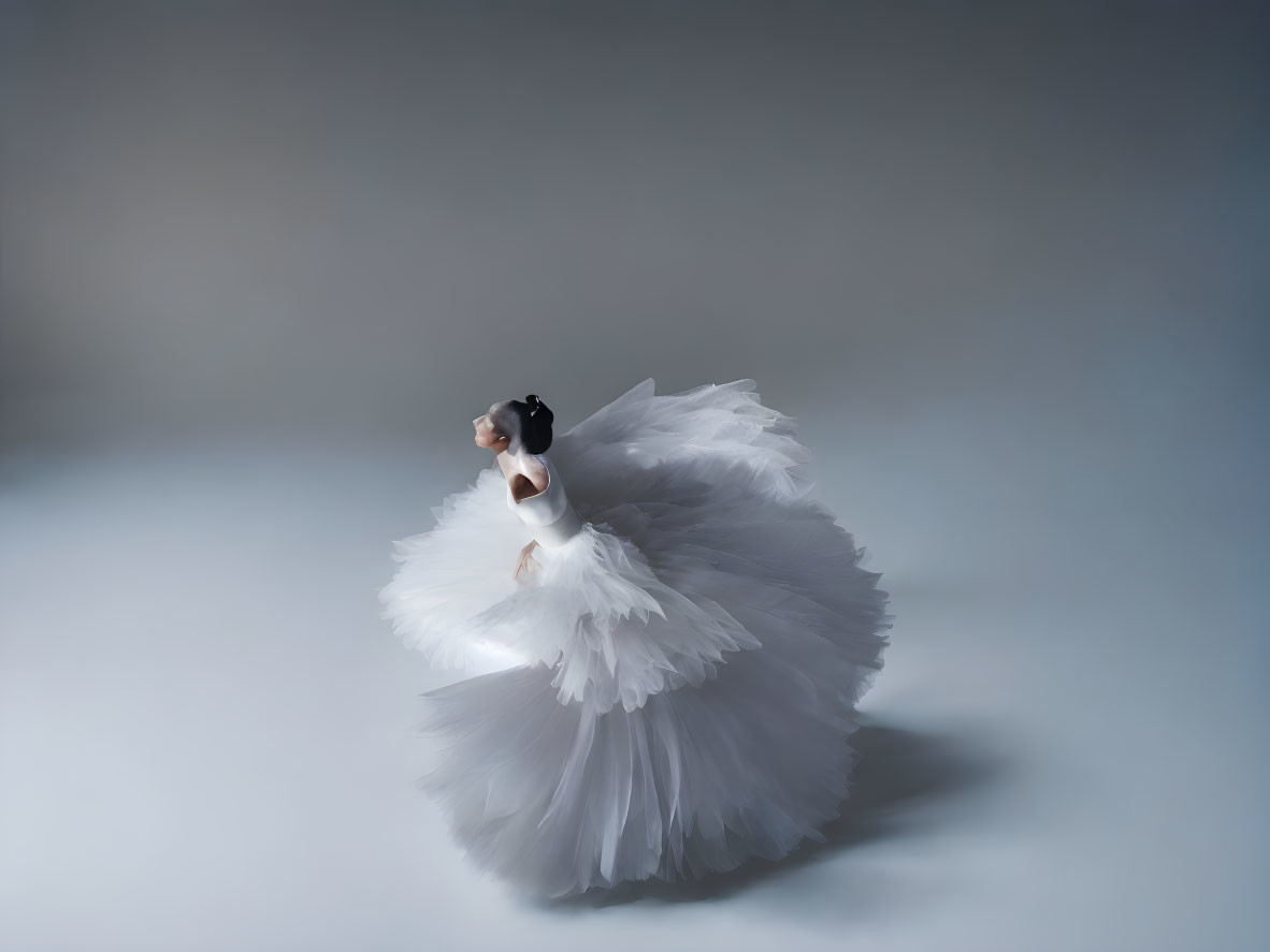 Elegant ballet dancer in white swan costume on blue gradient background