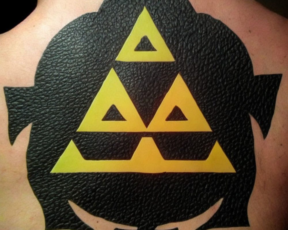 Triforce Symbol Tattoo on Upper Back with Black and Yellow Colors