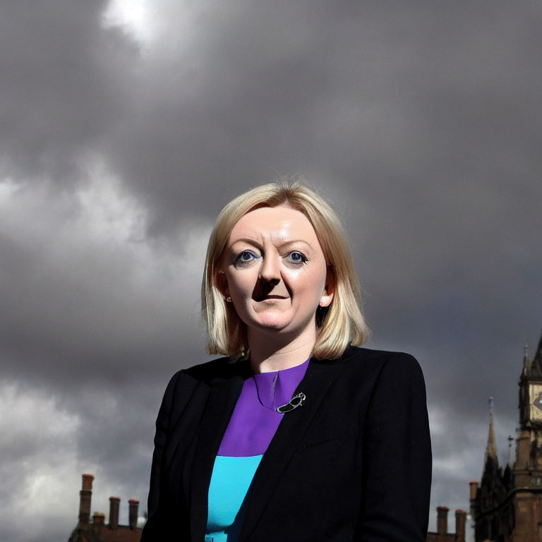 Blonde woman in professional attire under cloudy sky with architectural structures