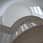 Modern interior with organic white shapes, skylights, and blue glass windows