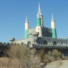 Whimsical Fantasy City with Turreted Buildings in Misty Environment