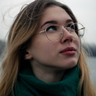 Portrait of Woman with Upward Gaze in Soft Lighting and Warm Tones