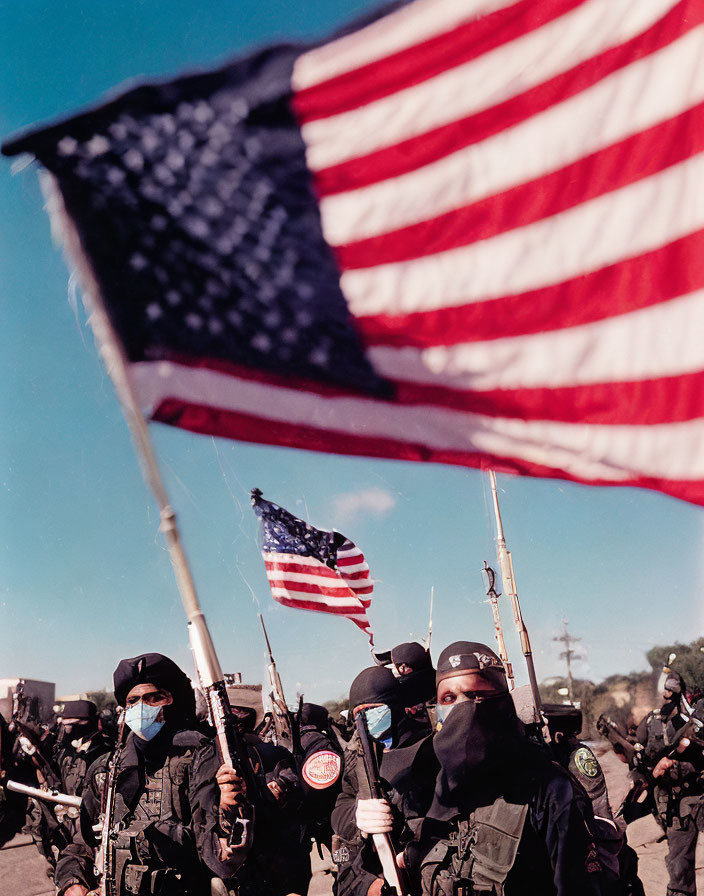 Uniformed Officers with Face Masks Carrying Rifles and American Flags