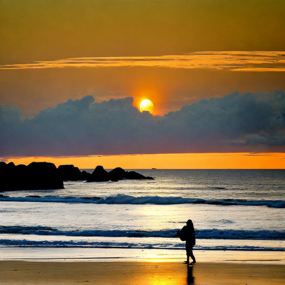 Silhouette of person walking on beach at sunset with cloudy sky and sun reflecting on water