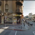 Rustic street scene with people, horses, and vintage architecture in an old town