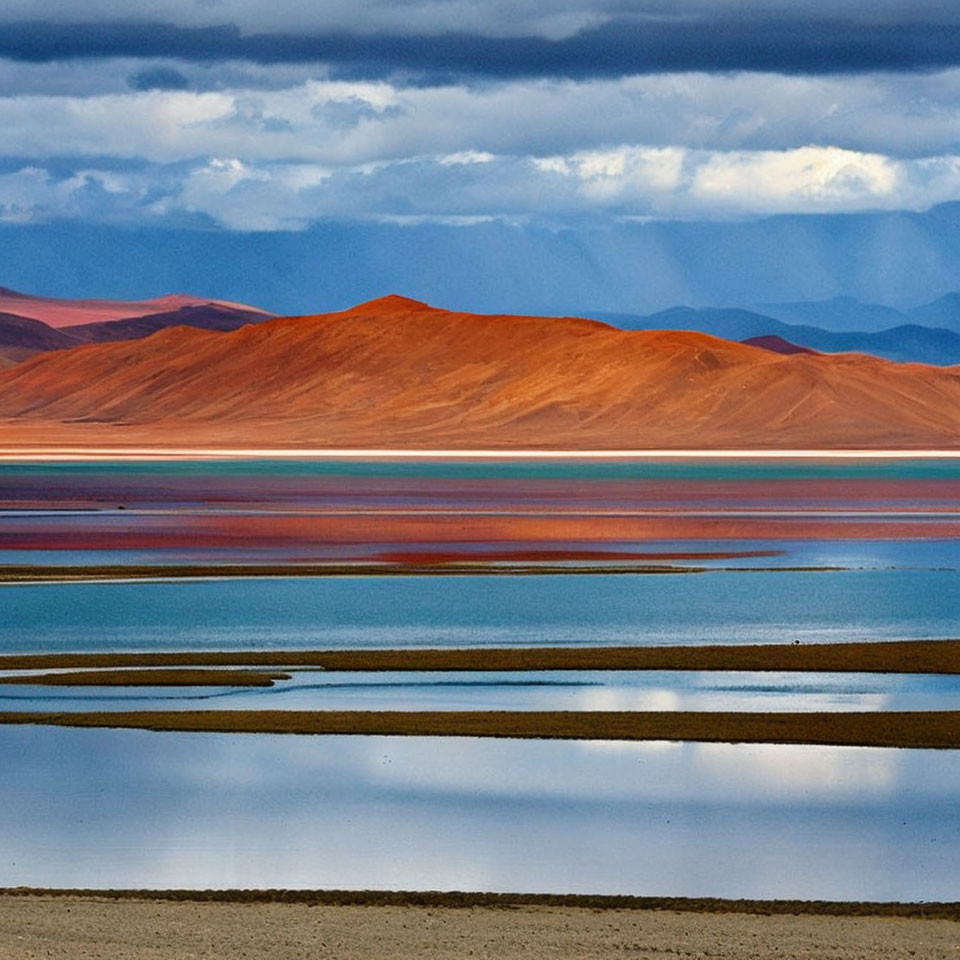 Colorful Landscape: Blue Lake, Pink Salt Flats, Orange Desert Hills