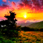 Colorful sunset sky over mountains with lone pine tree.