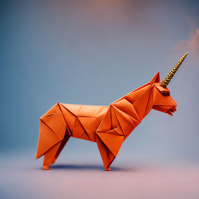 Orange Origami Unicorn with Golden Horn on Blue Gradient Background