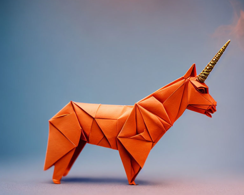 Orange Origami Unicorn with Golden Horn on Blue Gradient Background