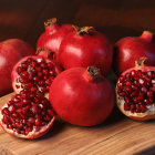 Hyperrealistic still life with jeweled pomegranates, pearl necklace, and gold brooch