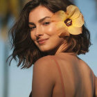 Portrait of Woman with Serene Gaze and Floral Hair Portrait