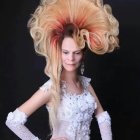 Elaborate White Hairstyle and Ornate Costume with Gold Accents