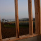 Blooming garden view through open wooden window frame