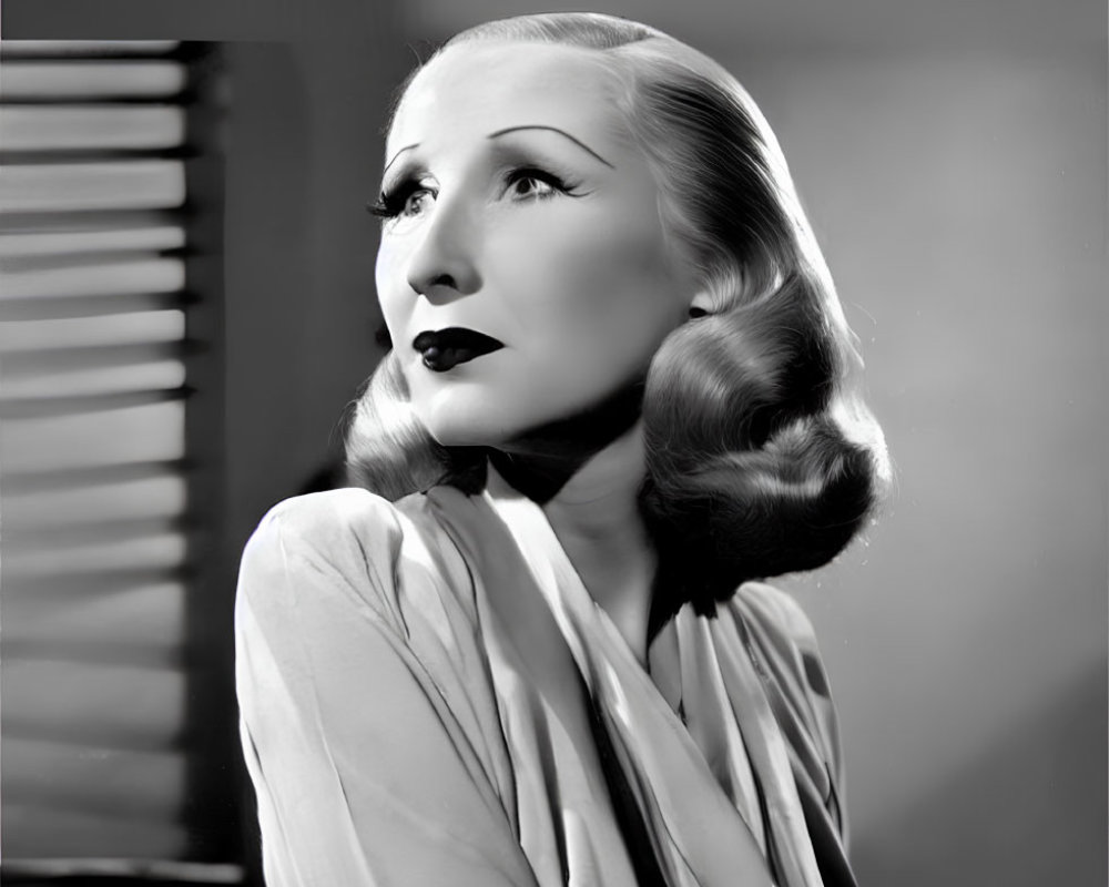 Monochrome portrait of a woman with 1930s-1940s Hollywood styling