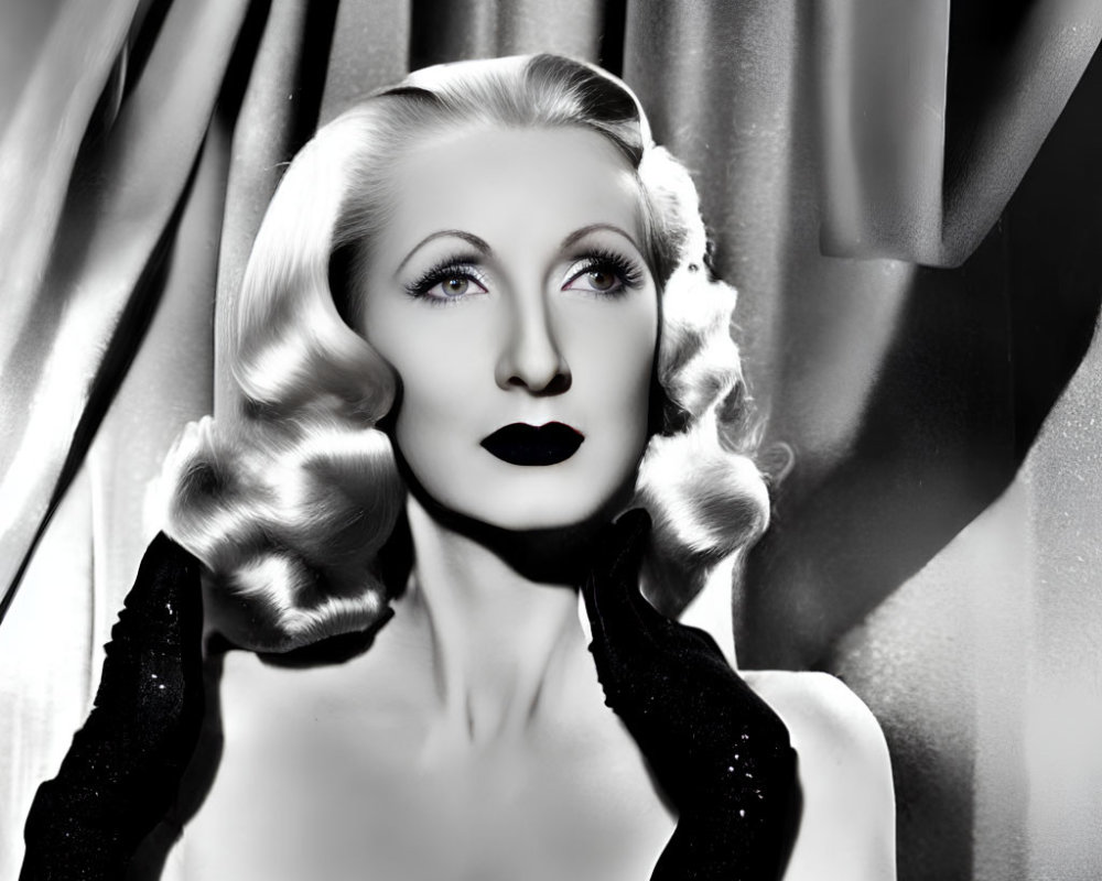 Vintage Hollywood glamour: Woman in black and white portrait with wavy blonde hair and elegant black dress