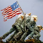 Children dressed as soldiers marching with American flag in patriotic scene