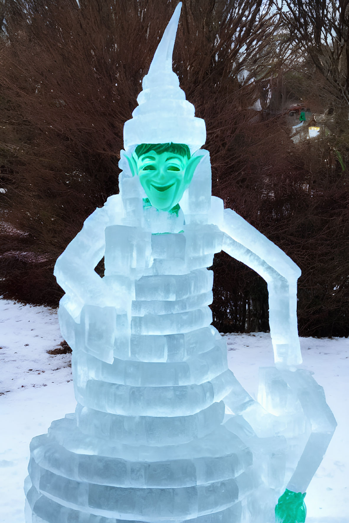 Detailed Ice Sculpture Depicting Smiling Figure on Tiered Base