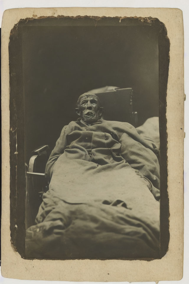 Somber Photograph of a Figure on a Bed in Sepia Tone