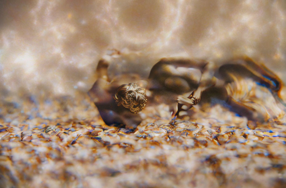 Colorful nudibranch crawling on textured seabed with blurred background