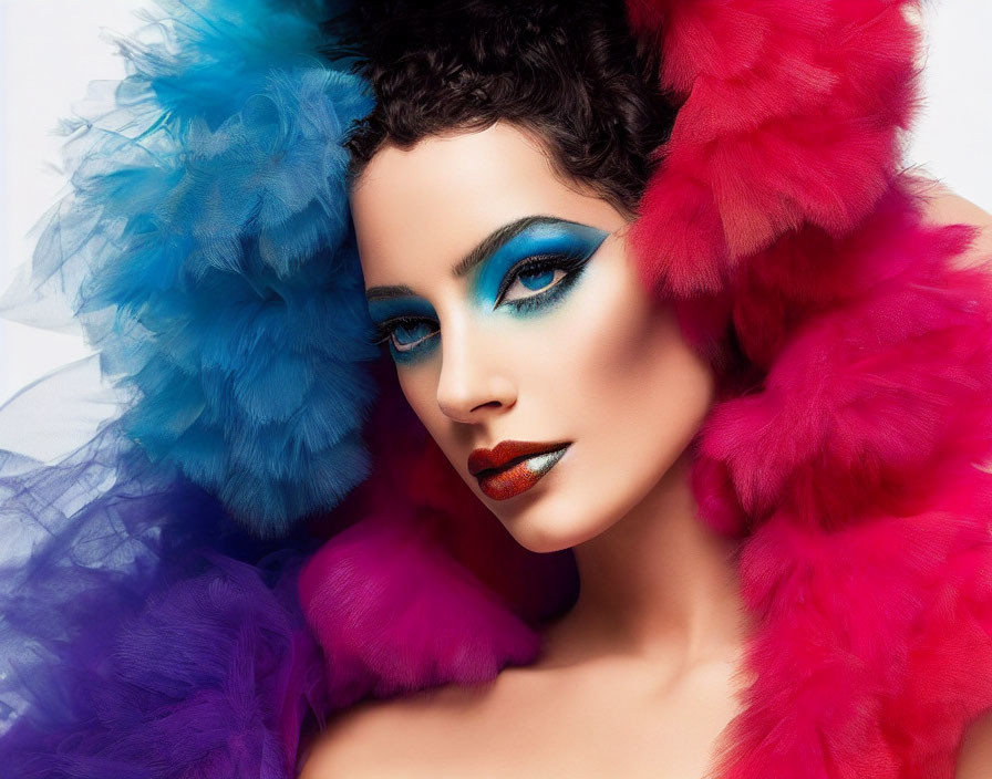 Woman with Dramatic Blue Eyeshadow and Glossy Orange Lipstick Surrounded by Colorful Fe