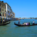 Venice landscape with gondolas, colorful buildings, and reflections