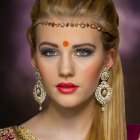 Elaborately dressed woman with intense gaze in red and gold attire