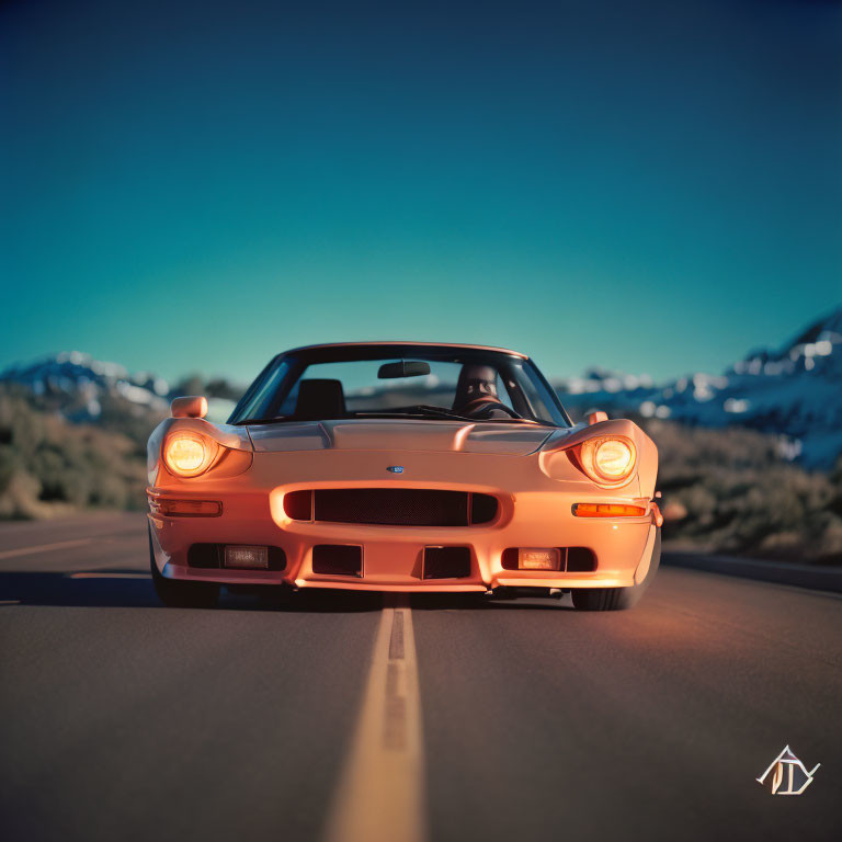 Orange sports car on center line of tranquil road with mountains and clear sky at dusk