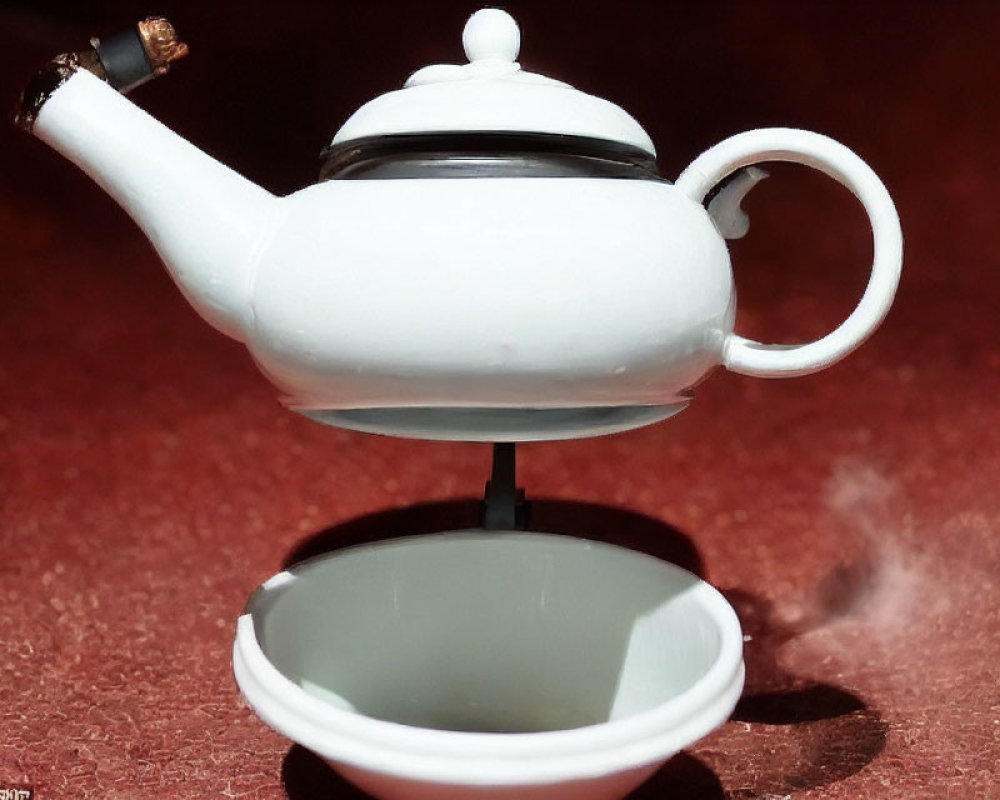 Levitating white ceramic teapot with steam above matching cup on red surface