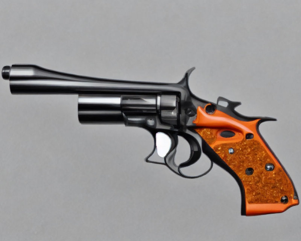 Shiny black revolver with orange-brown grip on gray background