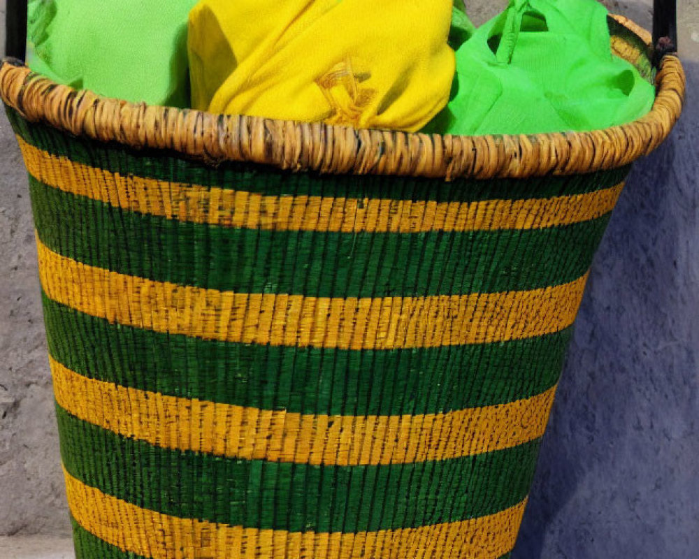 Green and Yellow Striped Woven Basket with Fabrics