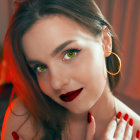 Digital artwork featuring woman with dark hair, makeup, gold earrings, and roses.