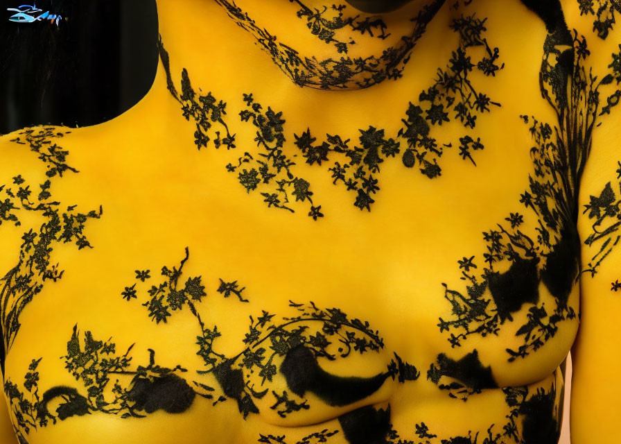 Detailed Close-Up of Yellow Skin with Black Lace Patterns on Shoulder and Chest