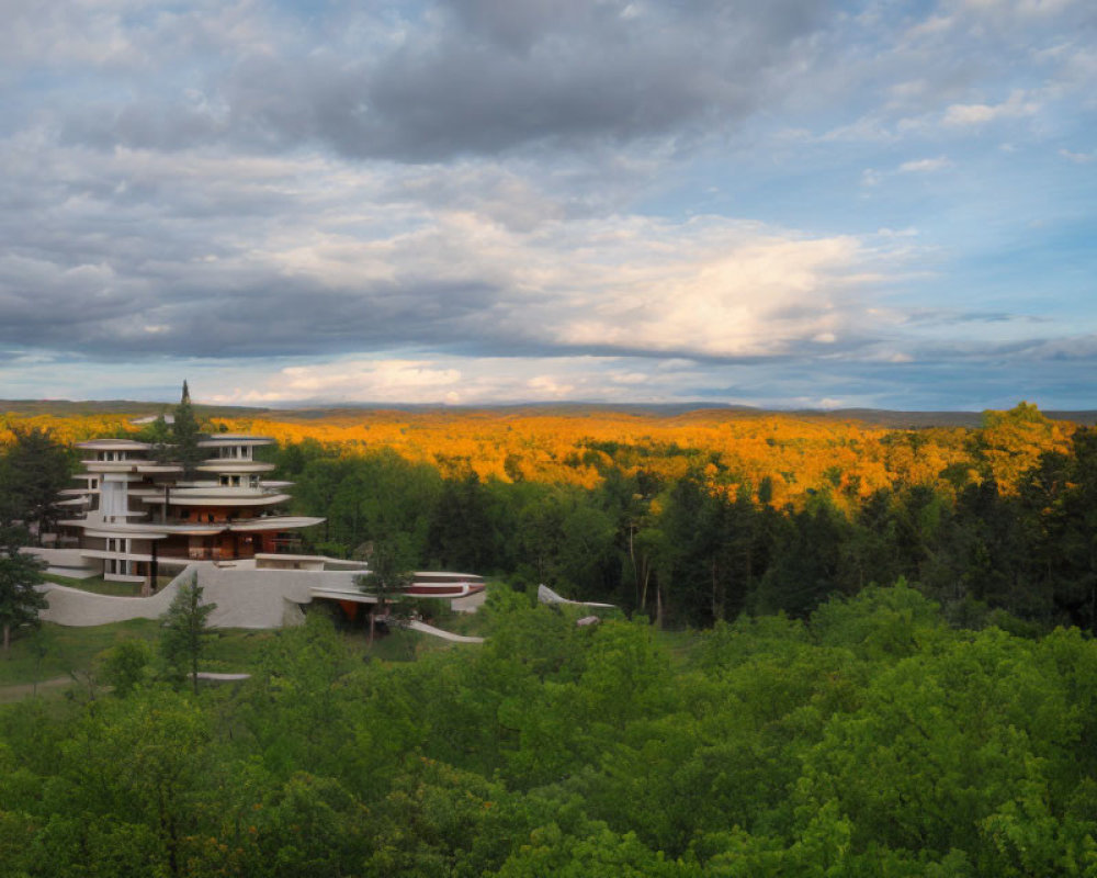 Modern multi-level building in lush autumn forest under dramatic sky