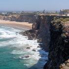 Rugged coastline with towering rock formations and sandy beaches