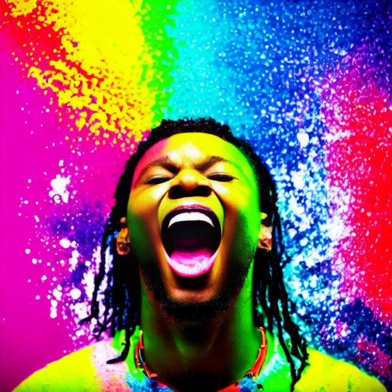 Joyful person with dreadlocks shouting against vibrant multicolored background