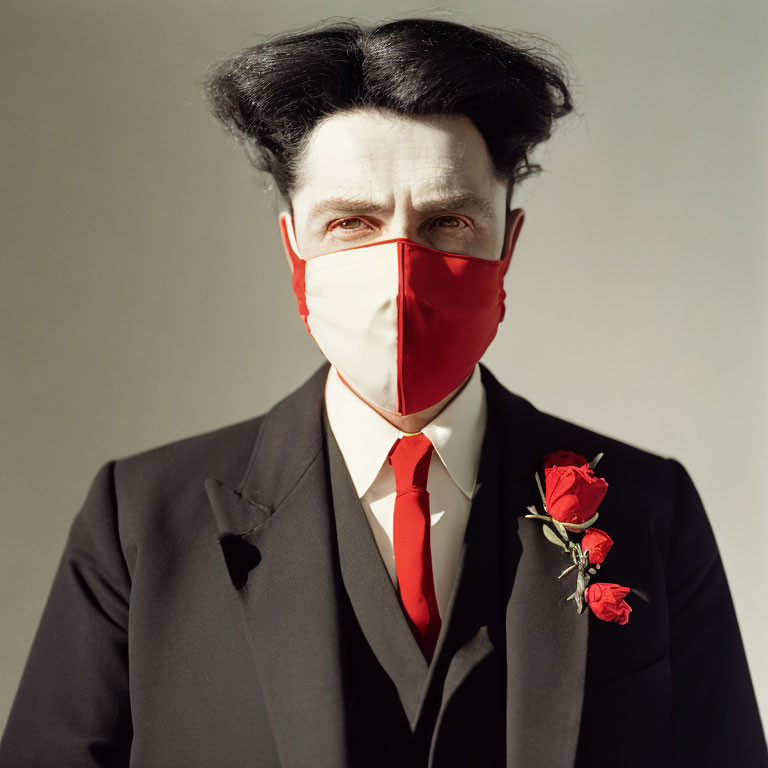 Person with Distinctive Hairstyle in Red Mask, Suit, Tie, and Red Roses